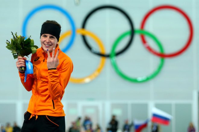 SOCHI, RUSSIA - FEBRUARY 09:  Gold medalist Irene Wust of the Netherlands celebrates on the podium during the flower ceremony for the Women's 3000m Speed Skating event during day 2 of the Sochi 2014 Winter Olympics at Adler Arena Skating Center on February 9, 2014 in Sochi, Russia.  (Photo by Quinn Rooney/Getty Images)